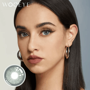The girl's face is looking straight ahead, the upper left is the Wooeye logo, and the lower left is a close-up of the baroque green contact lens