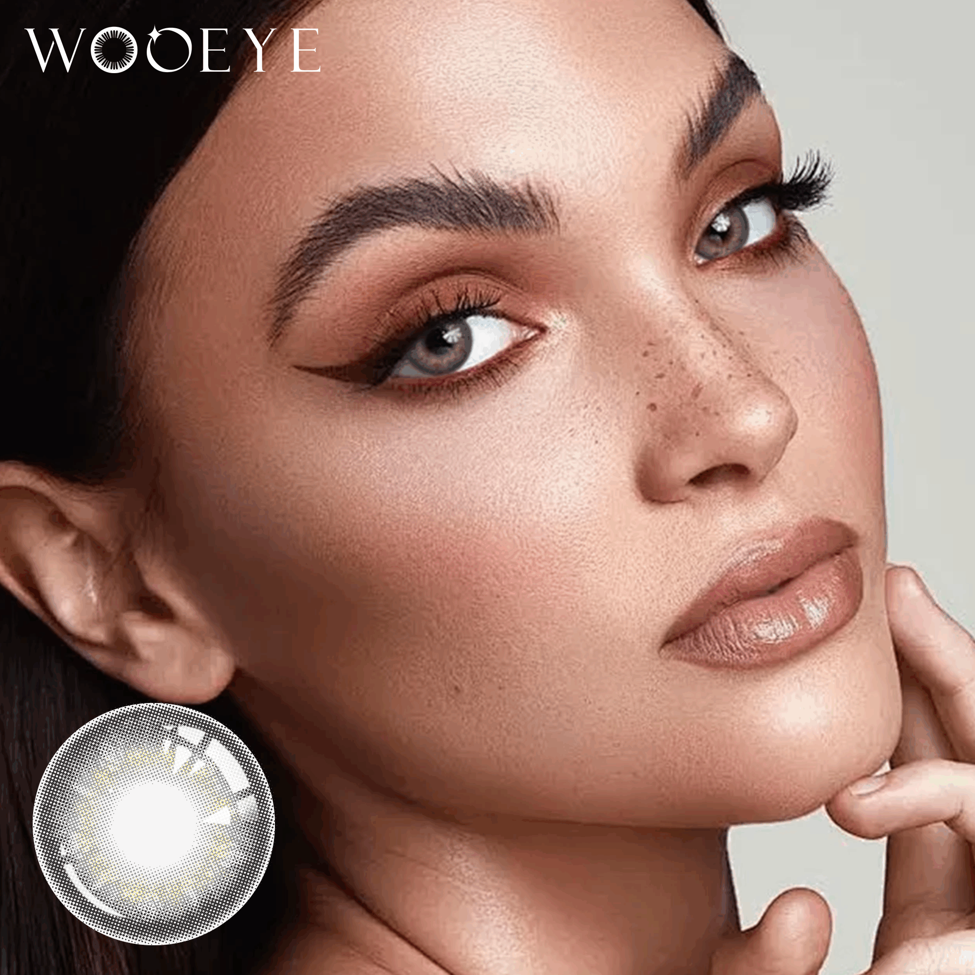 The girl's face is looking straight ahead, the upper left is the Wooeye logo, and the lower left is a close-up of the banshe grey contact lens