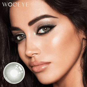 The girl's face is looking straight ahead, the upper left is the Wooeye logo, and the lower left is a close-up of the frozn green grey contact lens
