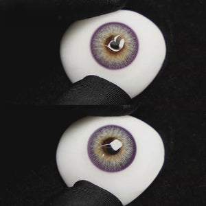A simulated brown prosthetic eye showing the visual transformation effect of wearing Wooeye Pola Purple colored contact lenses against a black background.