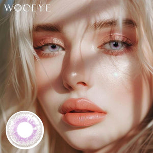 The girl's face is looking straight ahead, the upper left is the Wooeye logo, and the lower left is a close-up of the Salty purple contact lens