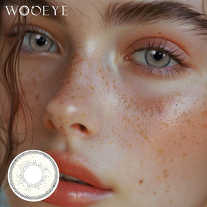 The girl's face is looking straight ahead, the upper left is the Wooeye logo, and the lower left is a close-up of the Cream Brown I contact lens