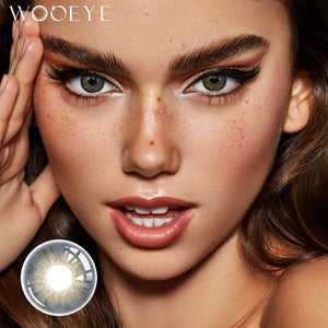 The girl's face is looking straight ahead, the upper left is the Wooeye logo, and the lower left is a close-up of the Dancer Deep Blue contact lens