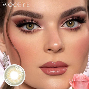 The girl's face is looking straight ahead, the upper left is the Wooeye logo, and the lower left is a close-up of the taylor brown contact lens