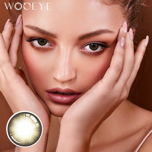 The girl's face is looking straight ahead, the upper left is the Wooeye logo, and the lower left is a close-up of the Acorn Brown contact lens