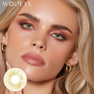 The girl's face is looking straight ahead, the upper left is the Wooeye logo, and the lower left is a close-up of the molly brown grey contact lens