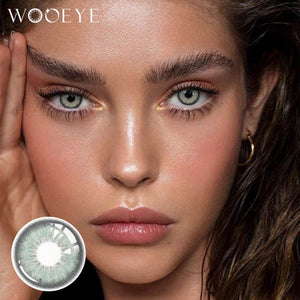 The girl's face is looking straight ahead, the upper left is the Wooeye logo, and the lower left is a close-up of the dancer light green contact lens
