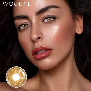 The girl's face is looking straight ahead, the upper left is the Wooeye logo, and the lower left is a close-up of the Wild Brown contact lens