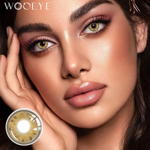 The girl's face is looking straight ahead, the upper left is the Wooeye logo, and the lower left is a close-up of the Beverly Brown contact lens