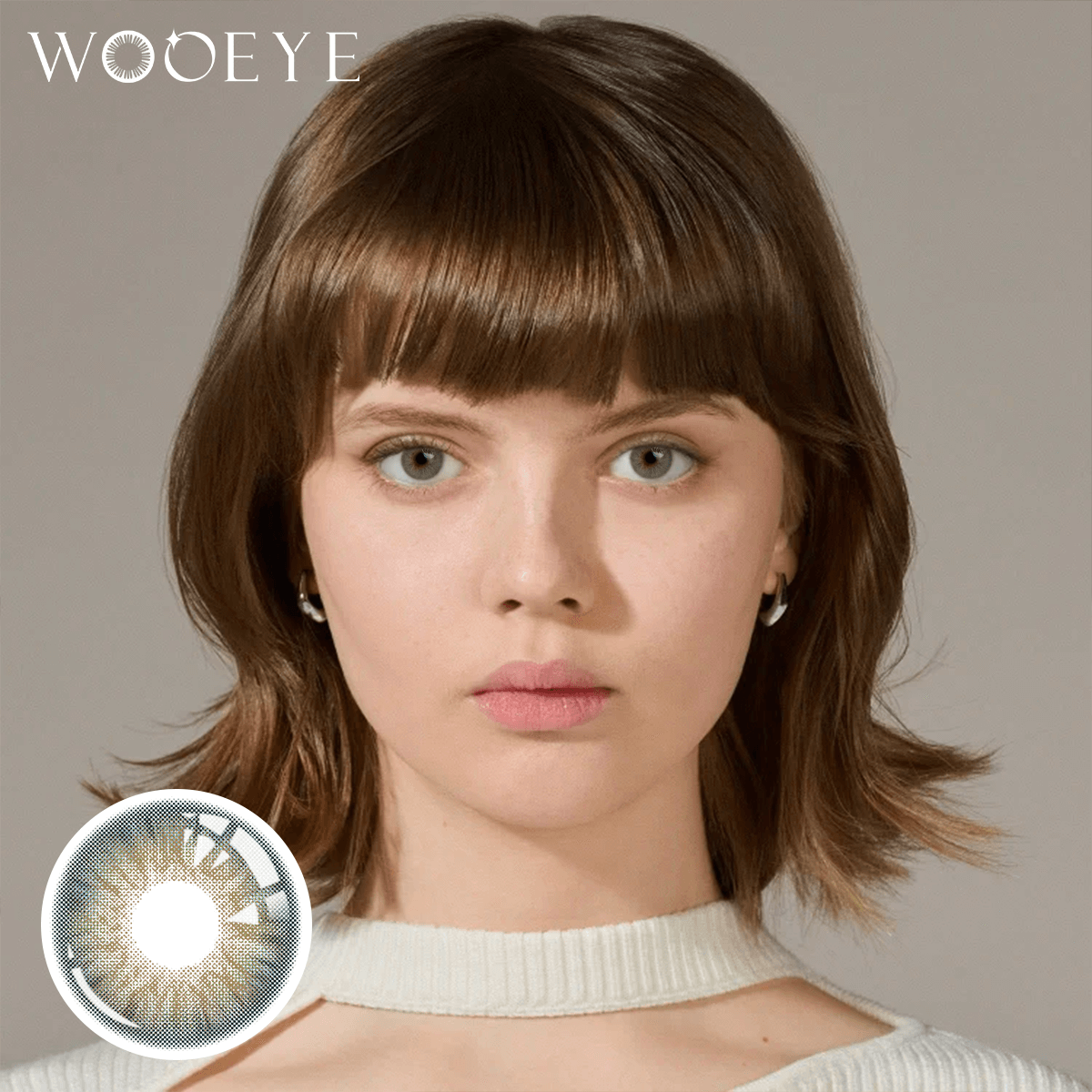 The girl's face is looking straight ahead, the upper left is the Wooeye logo, and the lower left is a close-up of the DancerDeepGreen contact lens