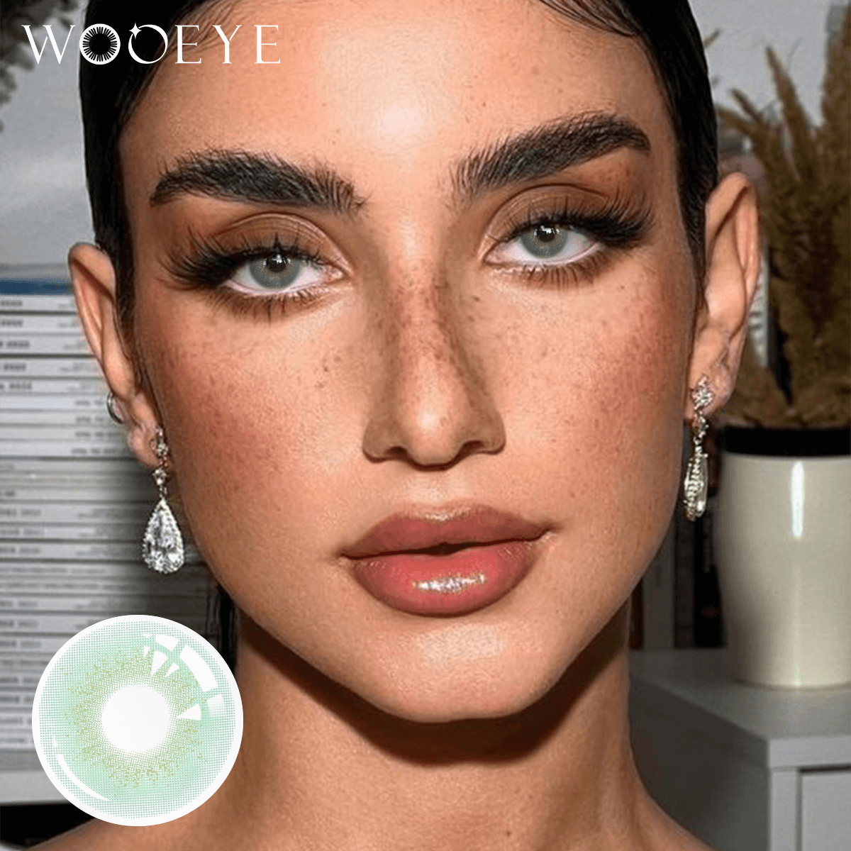 The girl's face is looking straight ahead, the upper left is the Wooeye logo, and the lower left is a close-up of the Glacier Green contact lens