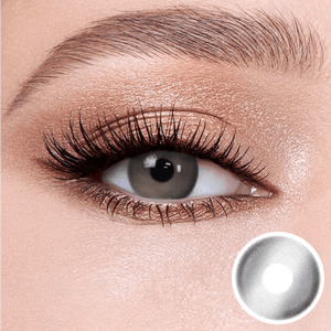 glass gray contact lenses on the eyes, close-up of the product on the lower right