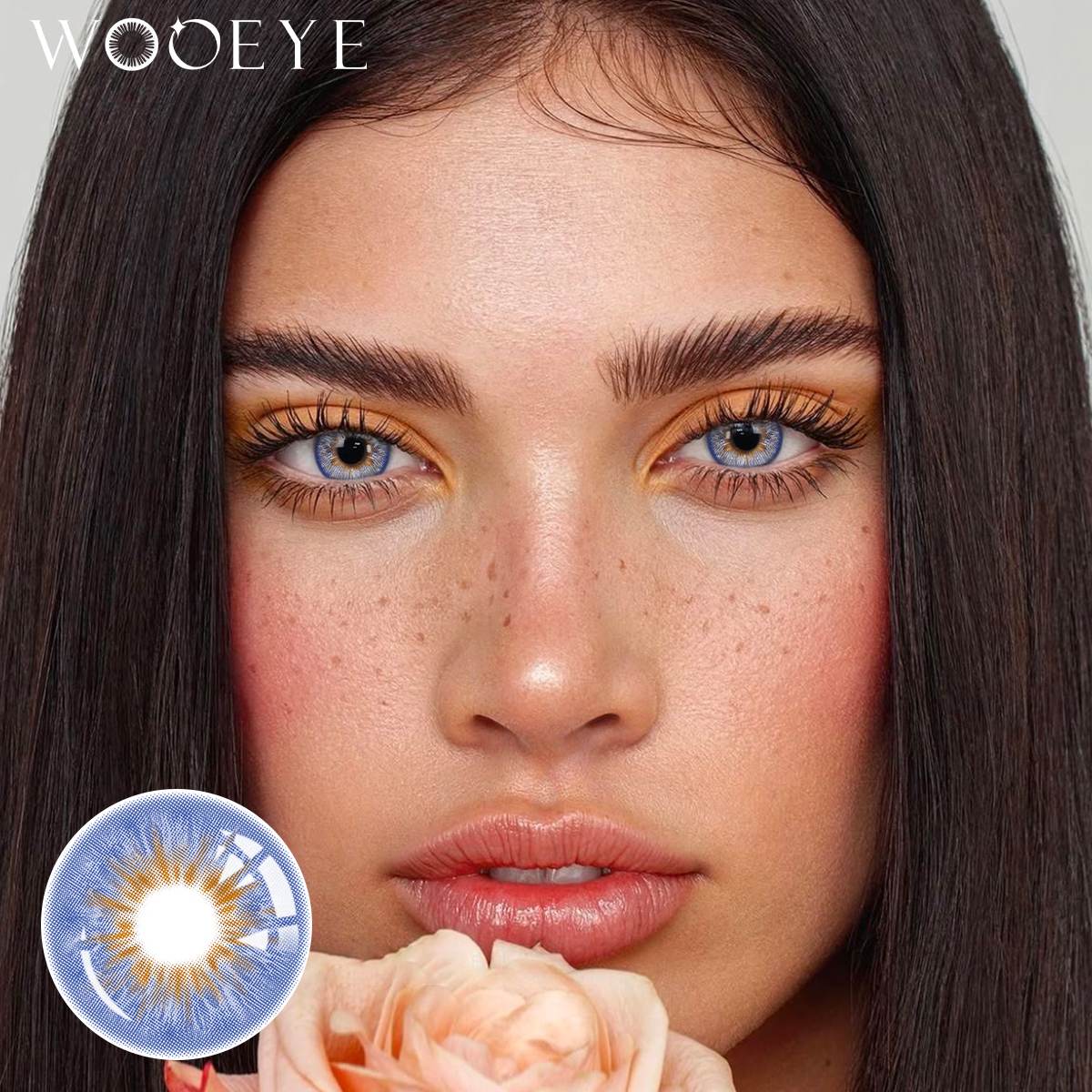The girl's face is looking straight ahead, the upper left is the Wooeye logo, and the lower left is a close-up of the Vegas Blue contact lens