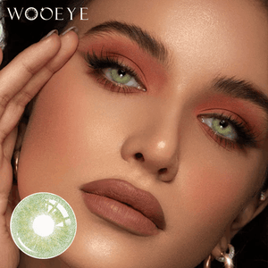 The girl's face is looking straight ahead, the upper left is the Wooeye logo, and the lower left is a close-up of the banshe green contact lens