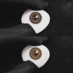 A simulated brown prosthetic eye showing the visual transformation effect of wearing dream lemon green colored contact lenses against a black background.