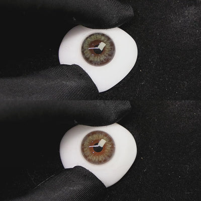 A simulated brown prosthetic eye showing the visual transformation effect of wearing dream lemon green colored contact lenses against a black background.