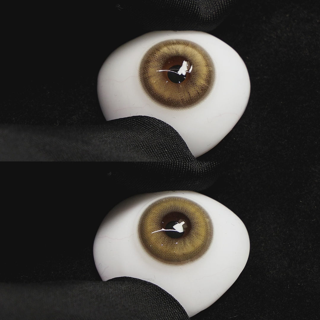 amber brown contact lenses on a brown simulated eyeball with a black background