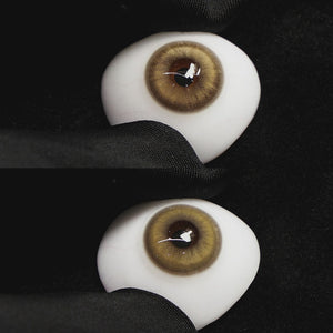 amber brown contact lenses on a brown simulated eyeball with a black background