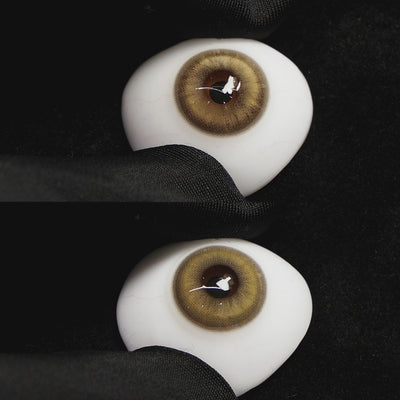 amber brown contact lenses on a brown simulated eyeball with a black background