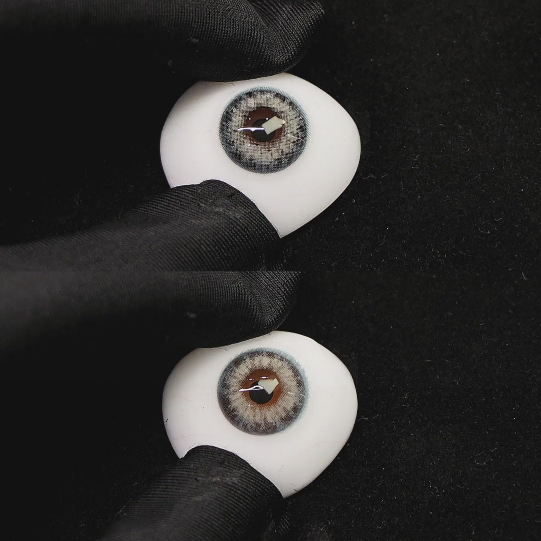 A simulated brown prosthetic eye showing the visual transformation effect of wearing angel blue colored contact lenses against a black background.
