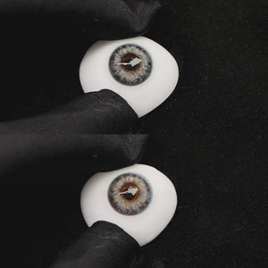 A simulated brown prosthetic eye showing the visual transformation effect of wearing angel blue colored contact lenses against a black background.