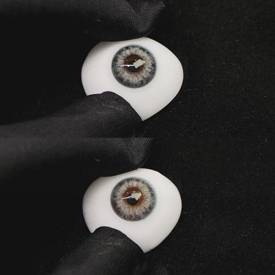 A simulated brown prosthetic eye showing the visual transformation effect of wearing angel blue colored contact lenses against a black background.