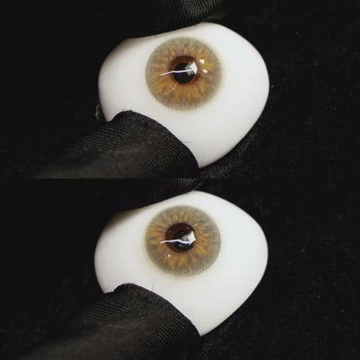A simulated brown prosthetic eye showing the visual transformation effect of wearing Molly Brown Grey colored contact lenses against a black background.