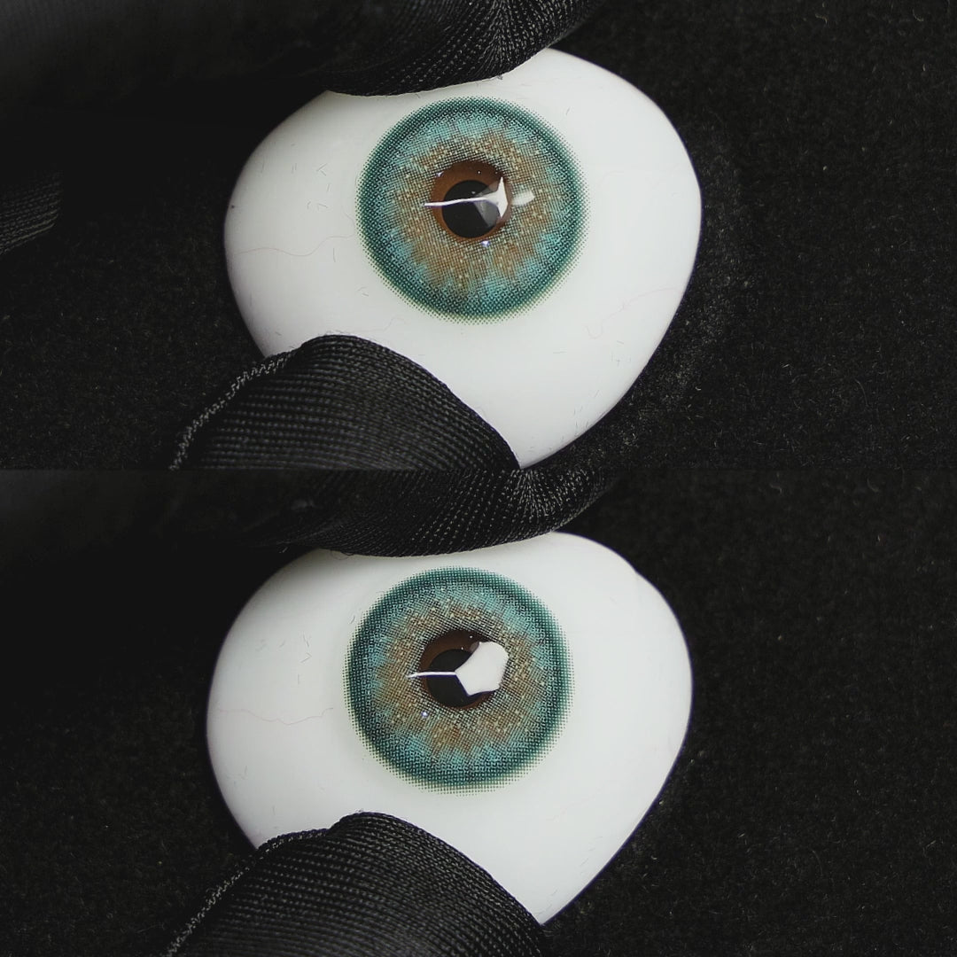 Star Green contact lenses on a brown simulated eyeball with a black background.