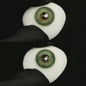 A simulated brown prosthetic eye showing the visual transformation effect of wearing Honeycomb Green colored contact lenses against a black background.