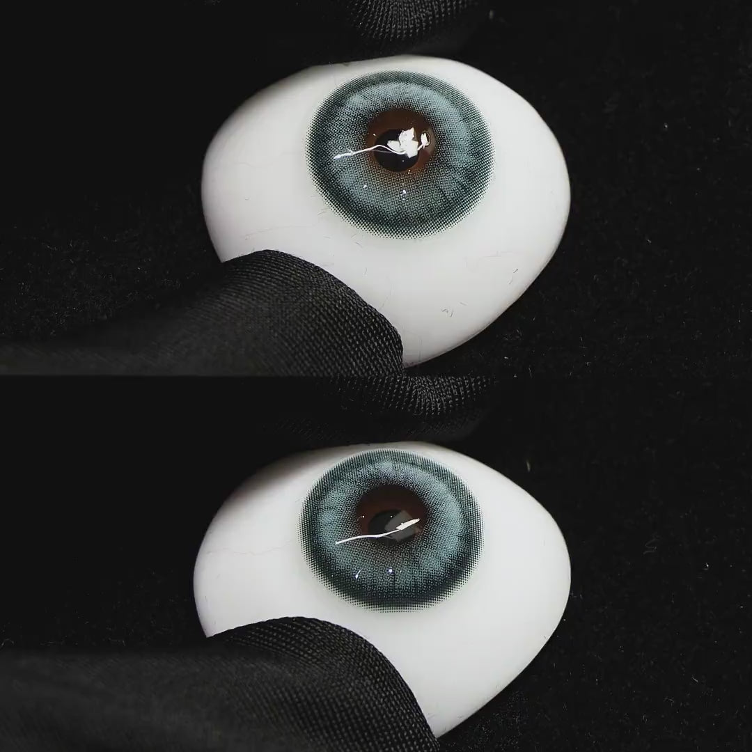 Amber Blue contact lenses on a brown simulated eyeball with a black background