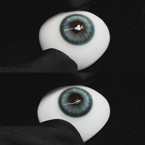 Amber Blue contact lenses on a brown simulated eyeball with a black background