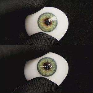 A simulated brown prosthetic eye showing the visual transformation effect of wearing Petal Blue colored contact lenses against a black background.