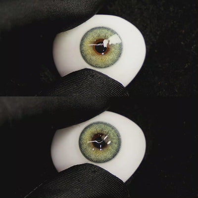 A simulated brown prosthetic eye showing the visual transformation effect of wearing Petal Blue colored contact lenses against a black background.