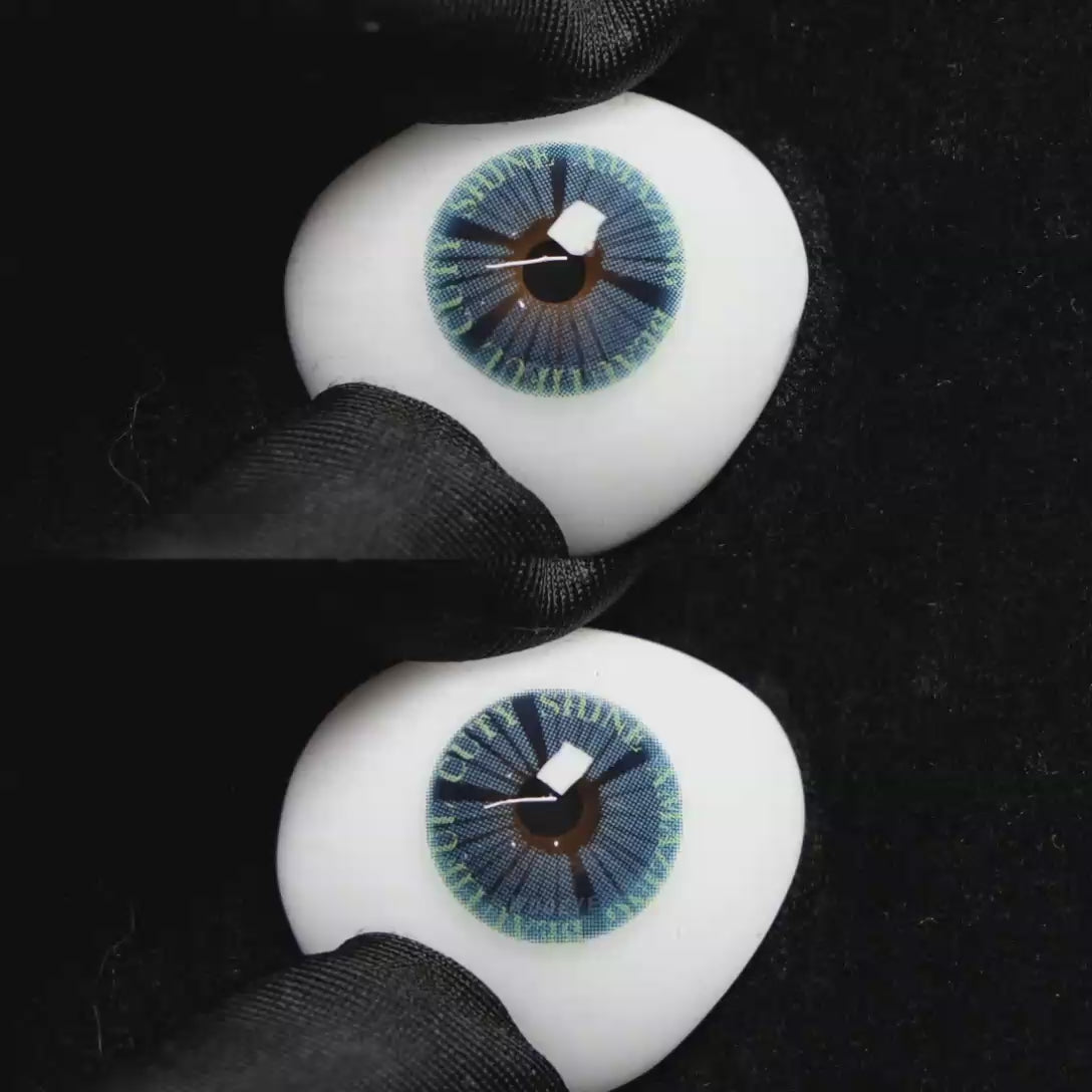 A simulated brown prosthetic eye showing the visual transformation effect of wearing Wooeye Plato Blue colored contact lenses against a black background.