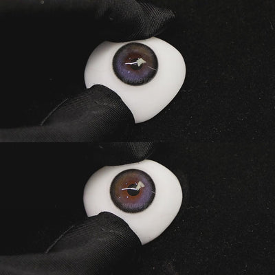 A simulated brown prosthetic eye showing the visual transformation effect of wearing nightfall seaside blue colored contact lenses against a black background.