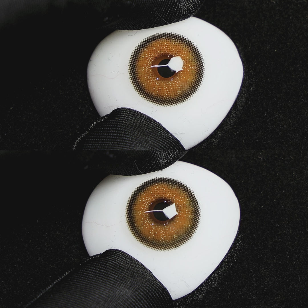 Wooeye Star Brown Contact Lenses on a brown simulated eyeball with a black background
