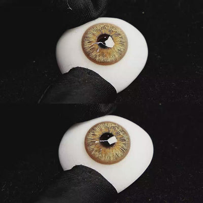 A simulated brown prosthetic eye showing the visual transformation effect of wearing Vegas Brown colored contact lenses against a black background.
