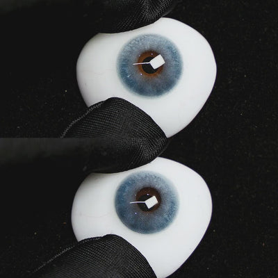 clouds blue contact lenses on a brown simulated eyeball with a black background