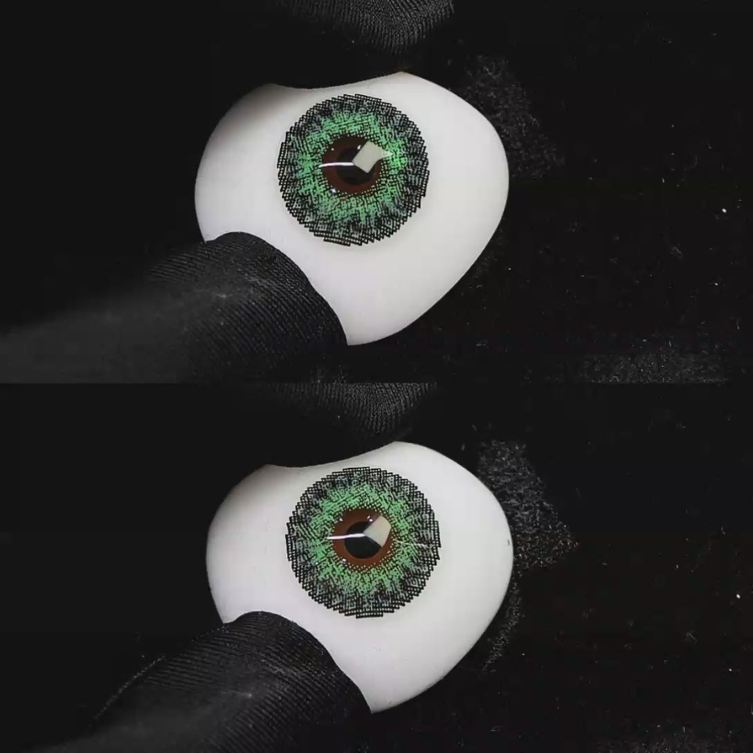 A simulated brown prosthetic eye showing the visual transformation effect of wearing Wooeye Freedom Forest Green colored contact lenses against a black background.
