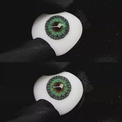 A simulated brown prosthetic eye showing the visual transformation effect of wearing Wooeye Freedom Forest Green colored contact lenses against a black background.