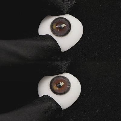 A simulated brown prosthetic eye showing the visual transformation effect of wearing misty gray colored contact lenses against a black background.