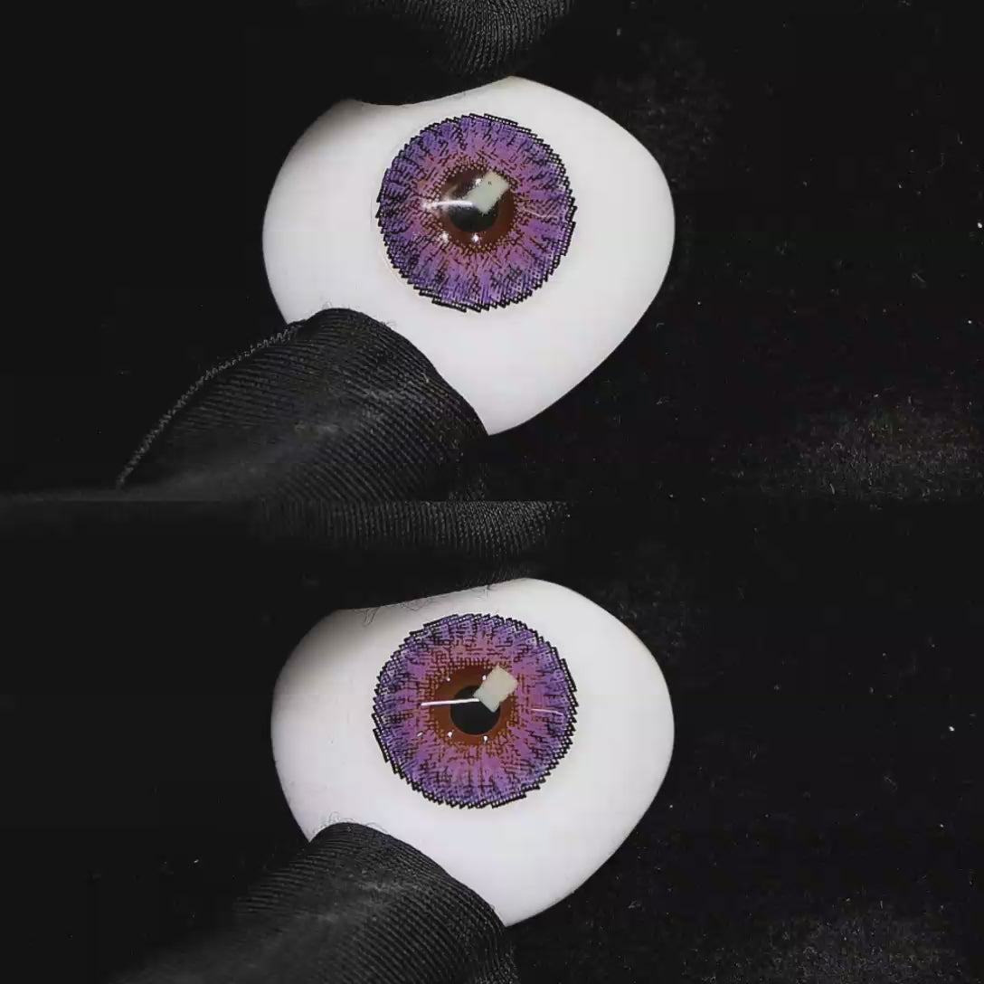 A simulated brown prosthetic eye showing the visual transformation effect of wearing Wooeye Freedom Yolanda Purple colored contact lenses against a black background.