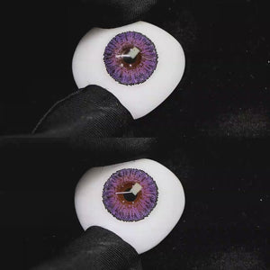 A simulated brown prosthetic eye showing the visual transformation effect of wearing Wooeye Freedom Yolanda Purple colored contact lenses against a black background.