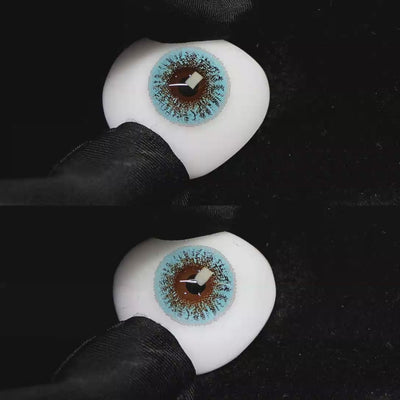 A simulated brown prosthetic eye showing the visual transformation effect of wearing Wooeye Freedom Blue colored contact lenses against a black background.