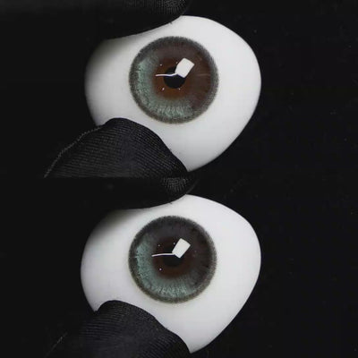 A simulated brown prosthetic eye showing the visual transformation effect of wearing Wooeye Bubbles Gray colored contact lenses against a black background.