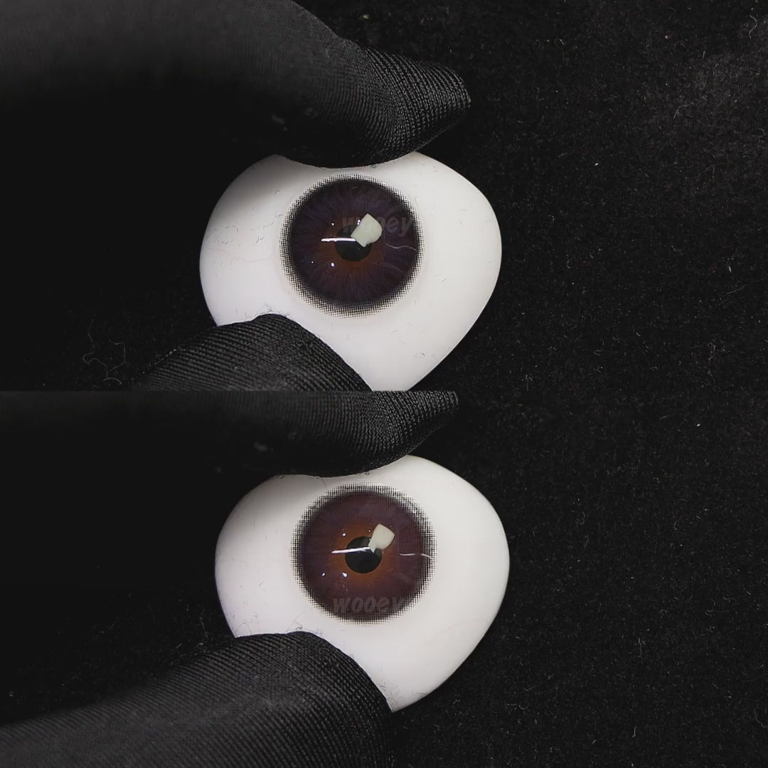 A simulated brown prosthetic eye showing the visual transformation effect of wearing diamond blue colored contact lenses against a black background.