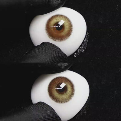 A simulated brown prosthetic eye showing the visual transformation effect of wearing Wooeye Romantic Brown colored contact lenses against a black background.