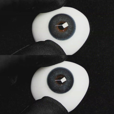 A simulated brown prosthetic eye showing the visual transformation effect of wearing Wooeye Star Blue colored contact lenses against a black background.
