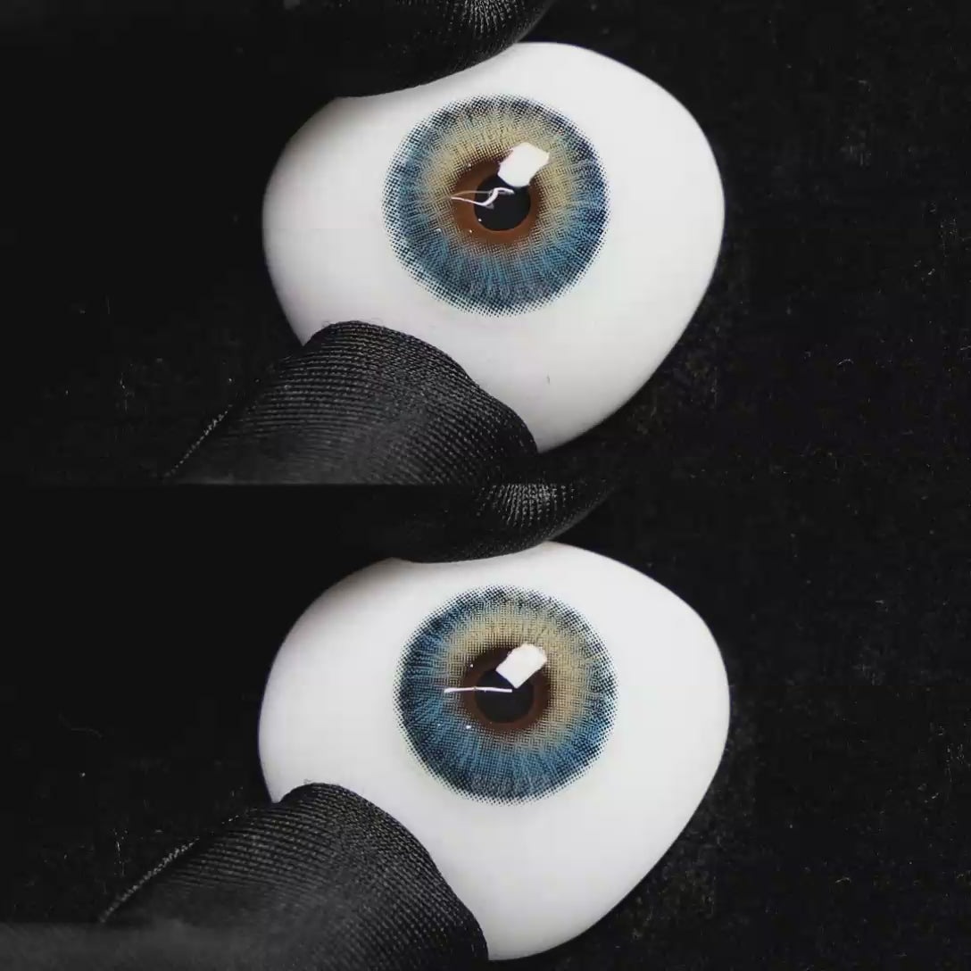 A simulated brown prosthetic eye showing the visual transformation effect of wearing Wooeye Romantic Blue colored contact lenses against a black background.