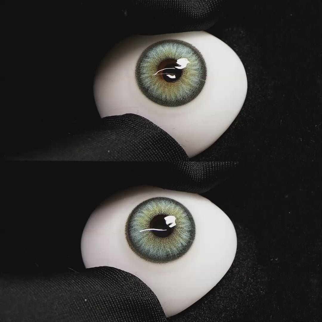 Diamond Green II contact lenses on a brown simulated eyeball with a black background